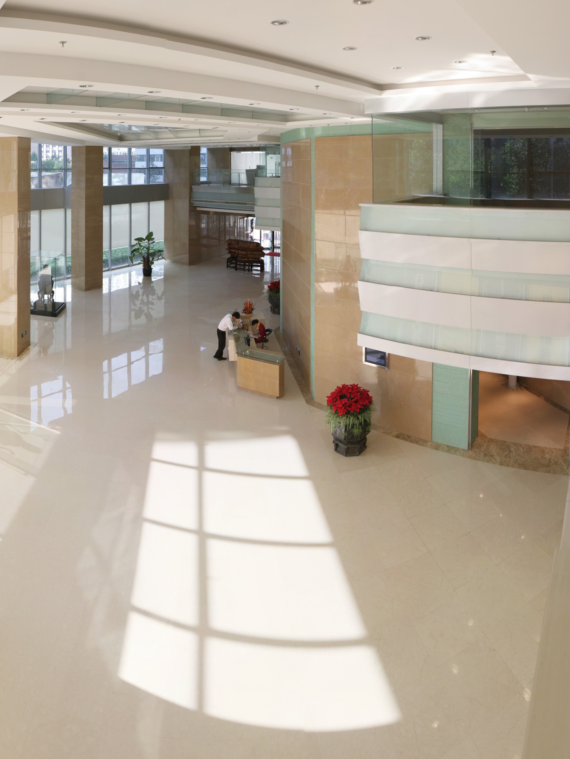 A second lobby, continuing the tower's language of glass and marble